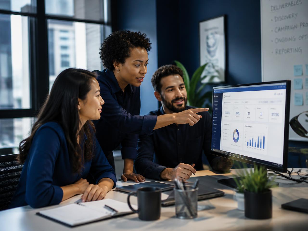 A small operations team reviewing customer pipeline data together on a Venovax dashboard